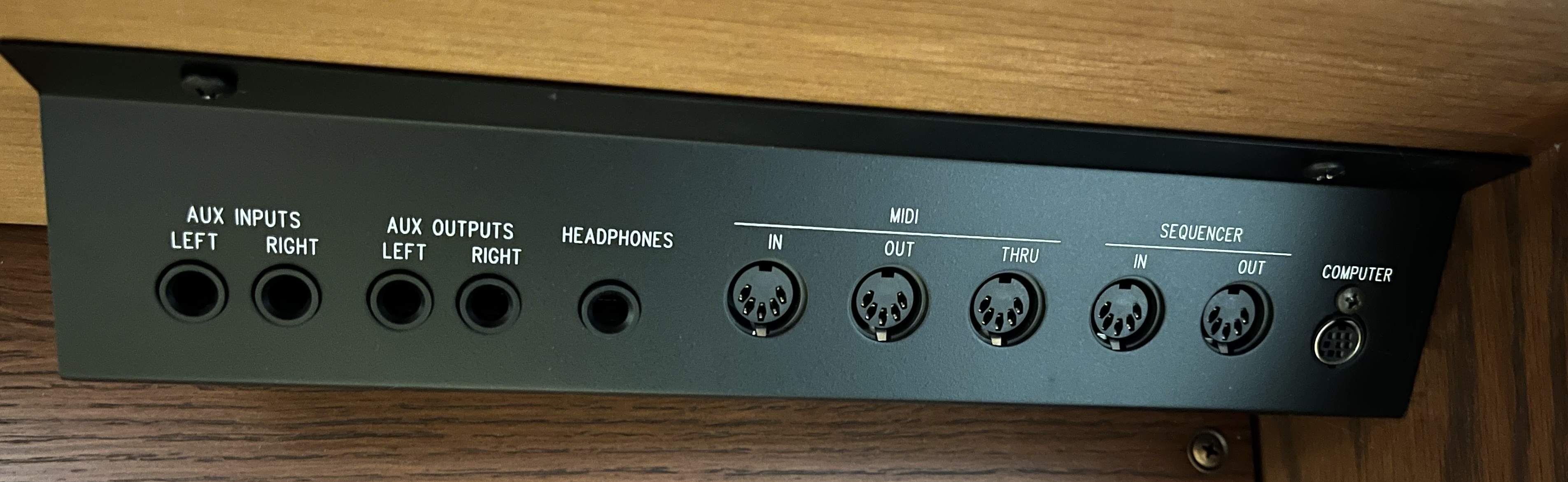 AUX inputs and SEQUENCER MIDI ports on the Rodgers 790C, located underneath the manuals on the right-hand side